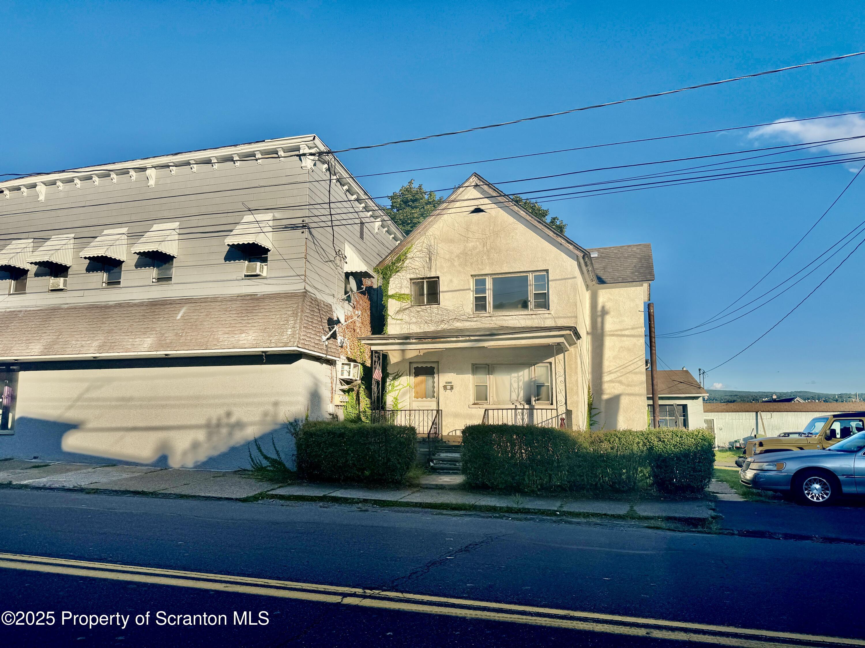 1430 North Main Avenue Scranton, PA 18508 - Photo 31 of 31 a view of a white house with a big yard and large trees