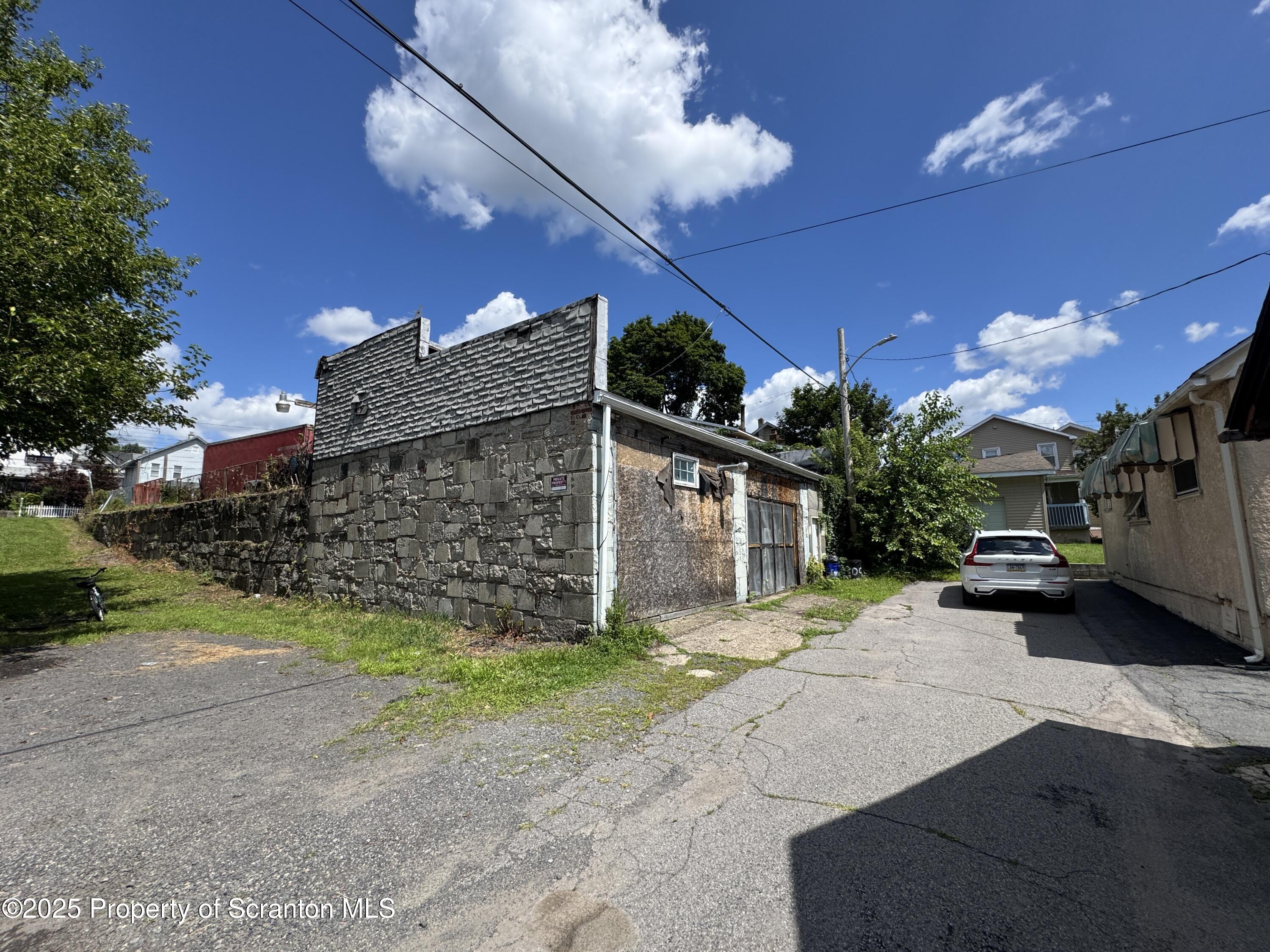 1430 North Main Avenue Scranton, PA 18508 - Photo 5 of 31 a view of a house with a patio