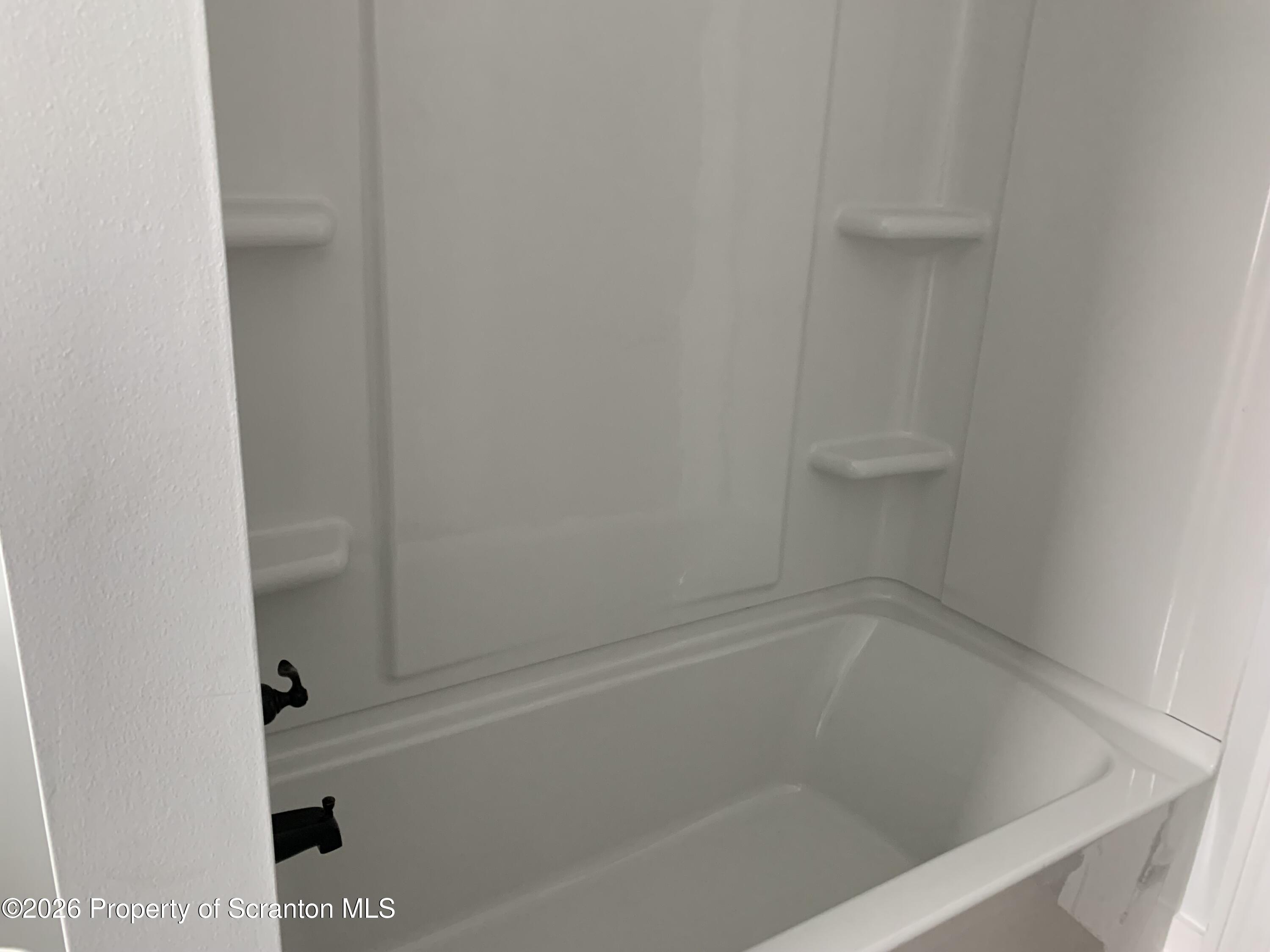 709 Meade Street Dunmore, PA 18512 - Photo 11 of 38 a close up of a bathtub