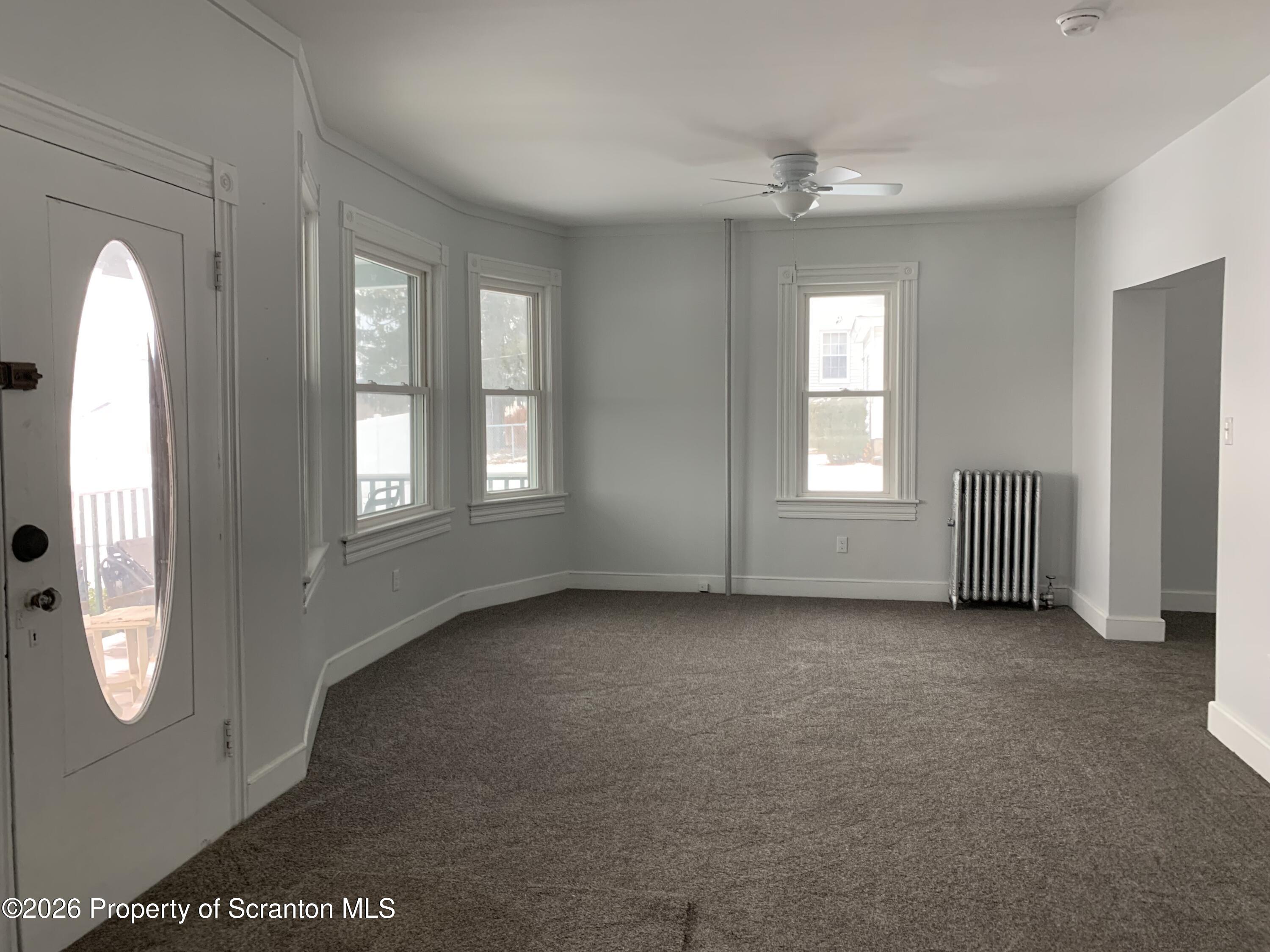 709 Meade Street Dunmore, PA 18512 - Photo 14 of 38 an empty room with windows