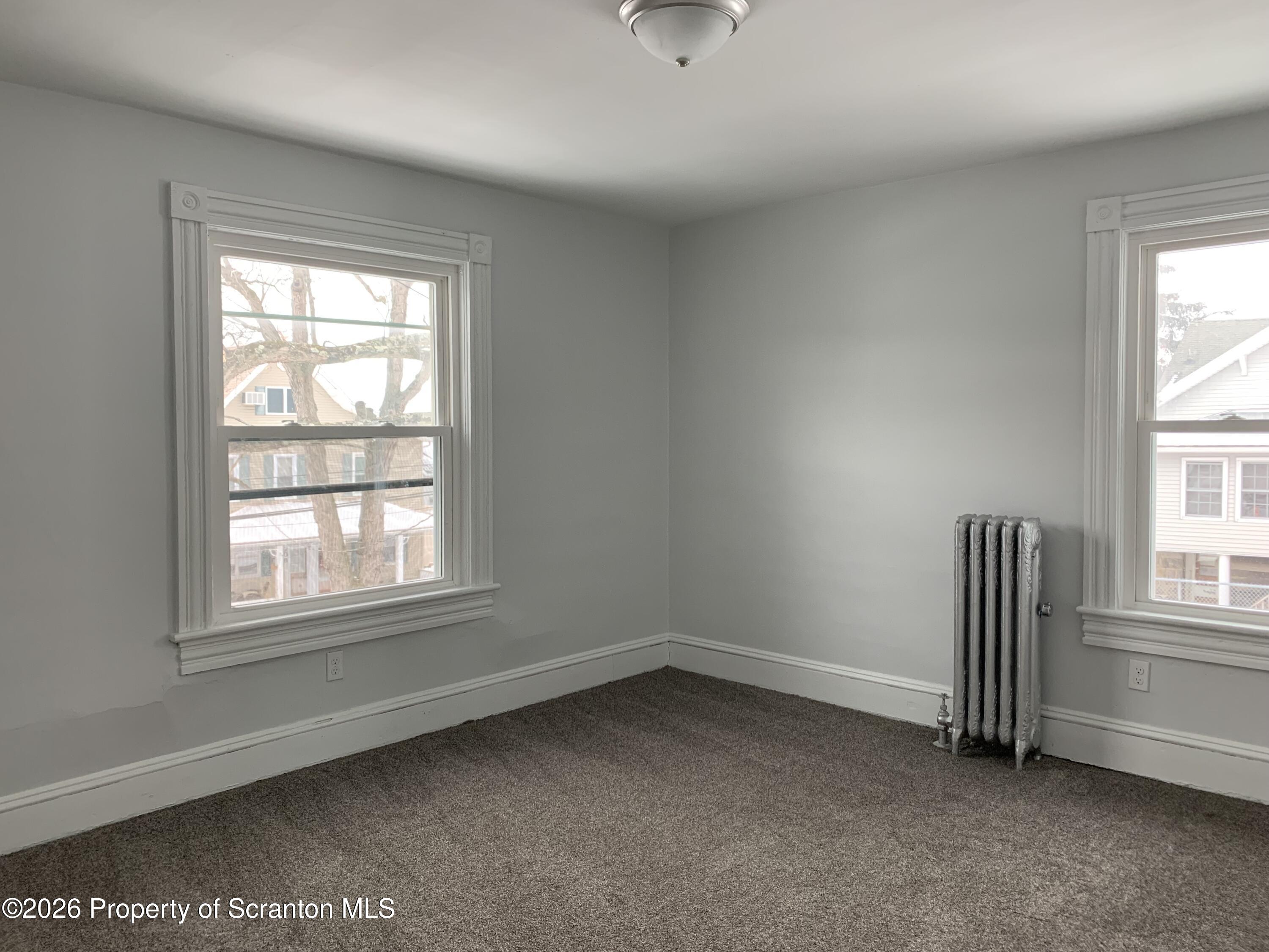 709 Meade Street Dunmore, PA 18512 - Photo 18 of 38 an empty room with a window