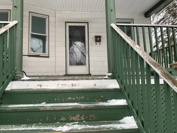 a view of house with front door
