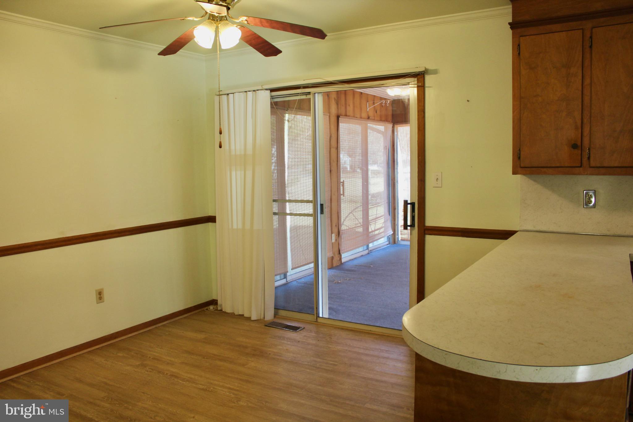 7179 Walston Switch Road Parsonsburg, MD 21849 - Photo 12 of 32 Bright and airy space with outdoor access.