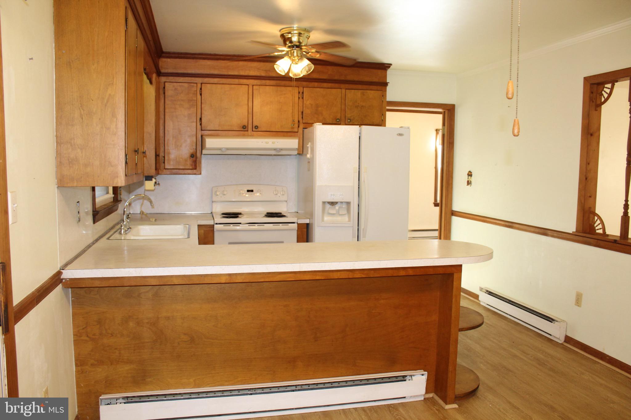 7179 Walston Switch Road Parsonsburg, MD 21849 - Photo 9 of 32 Cozy kitchen with warm wooden accents.