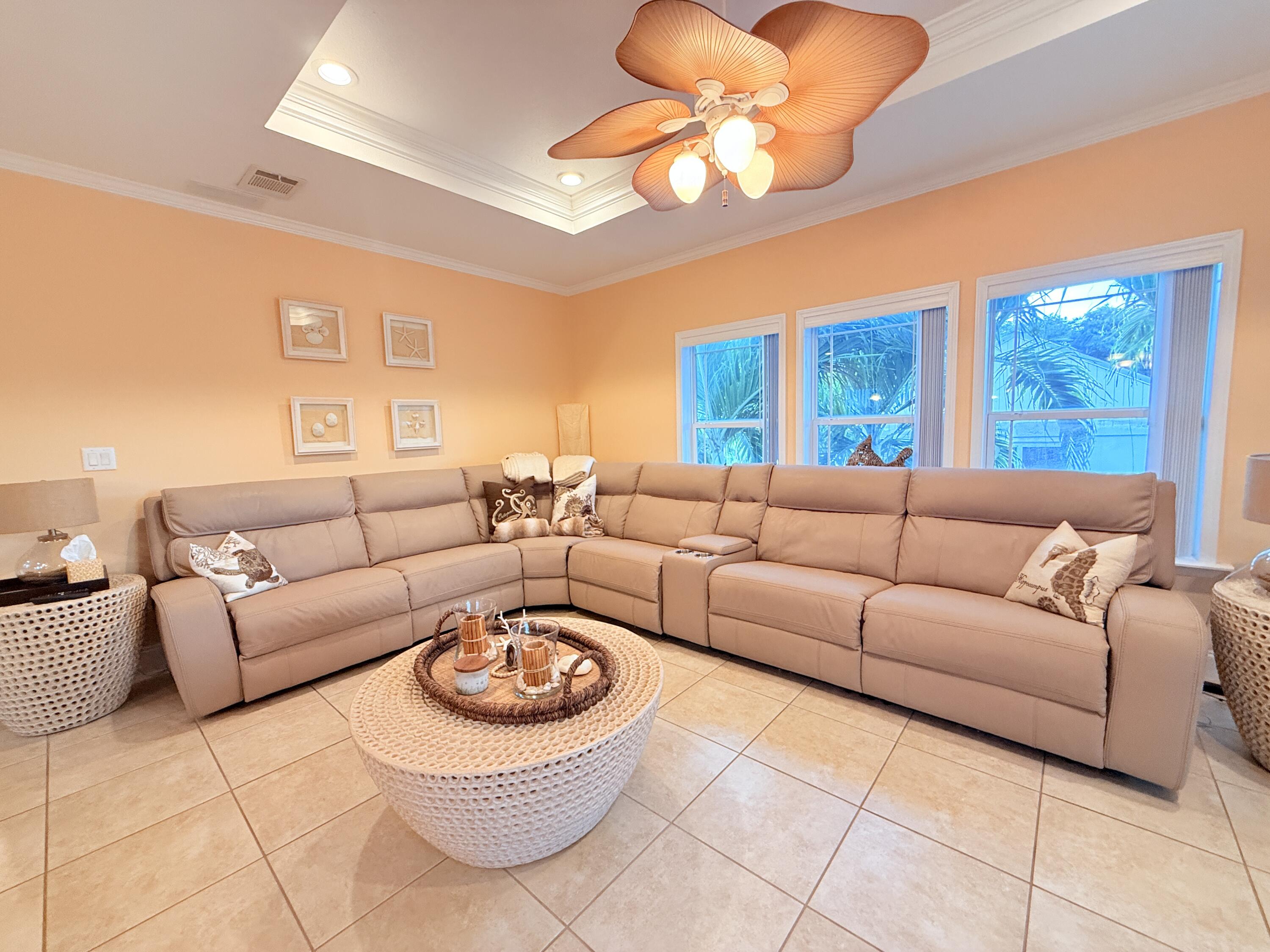 903 Tropical Lane Key Largo, FL 33037 - Photo 13 of 46 a living room with furniture a rug and a chandelier