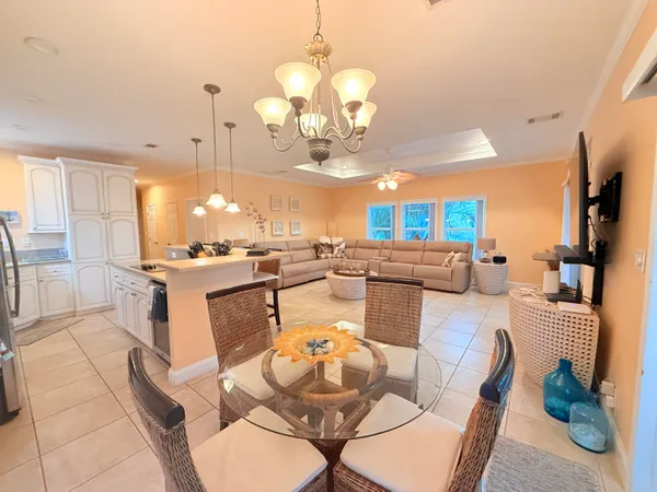 a bedroom with a bed and a flat tv screen on the dresser