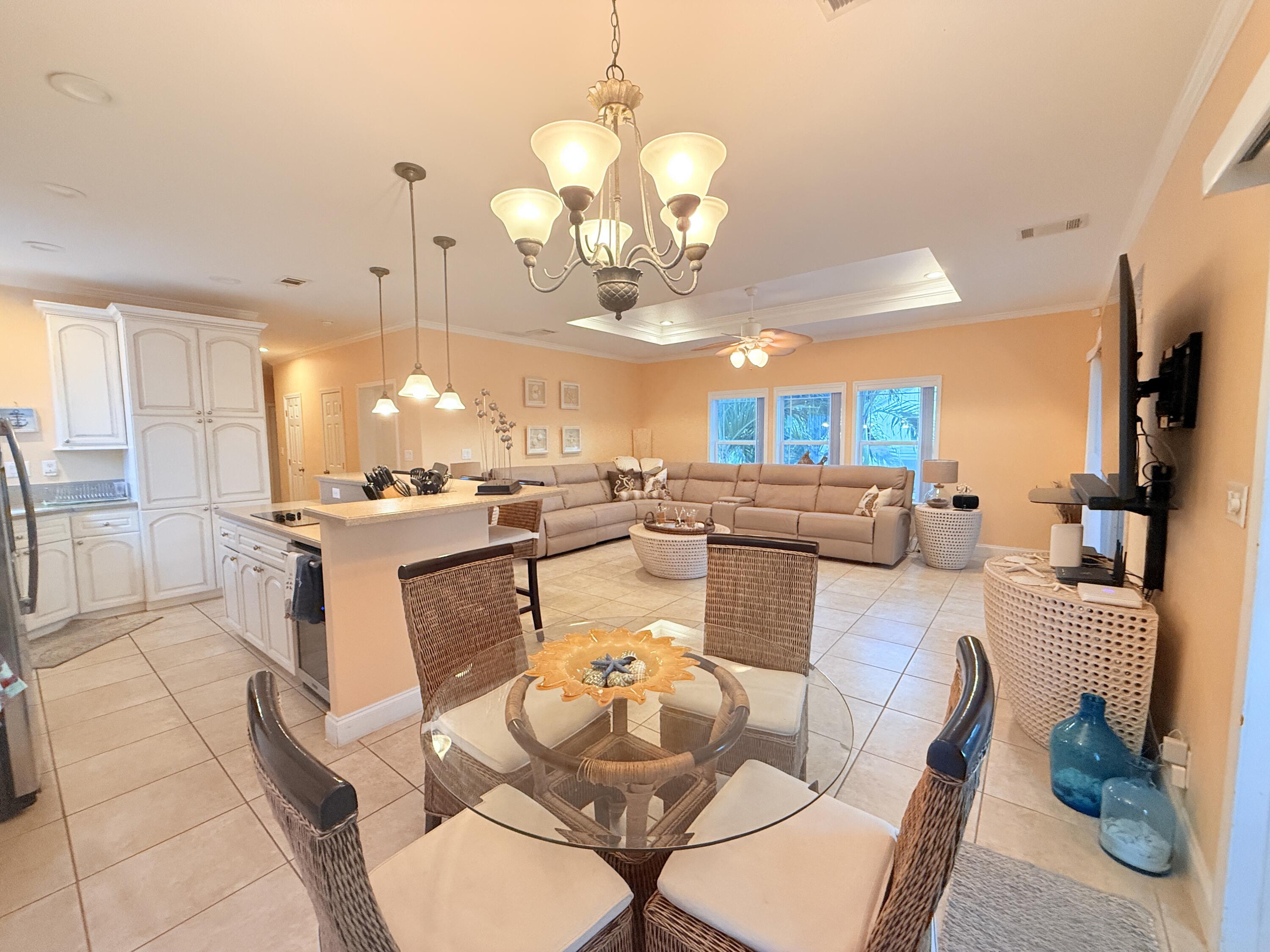 903 Tropical Lane Key Largo, FL 33037 - Photo 15 of 46 a large kitchen with a table and chairs