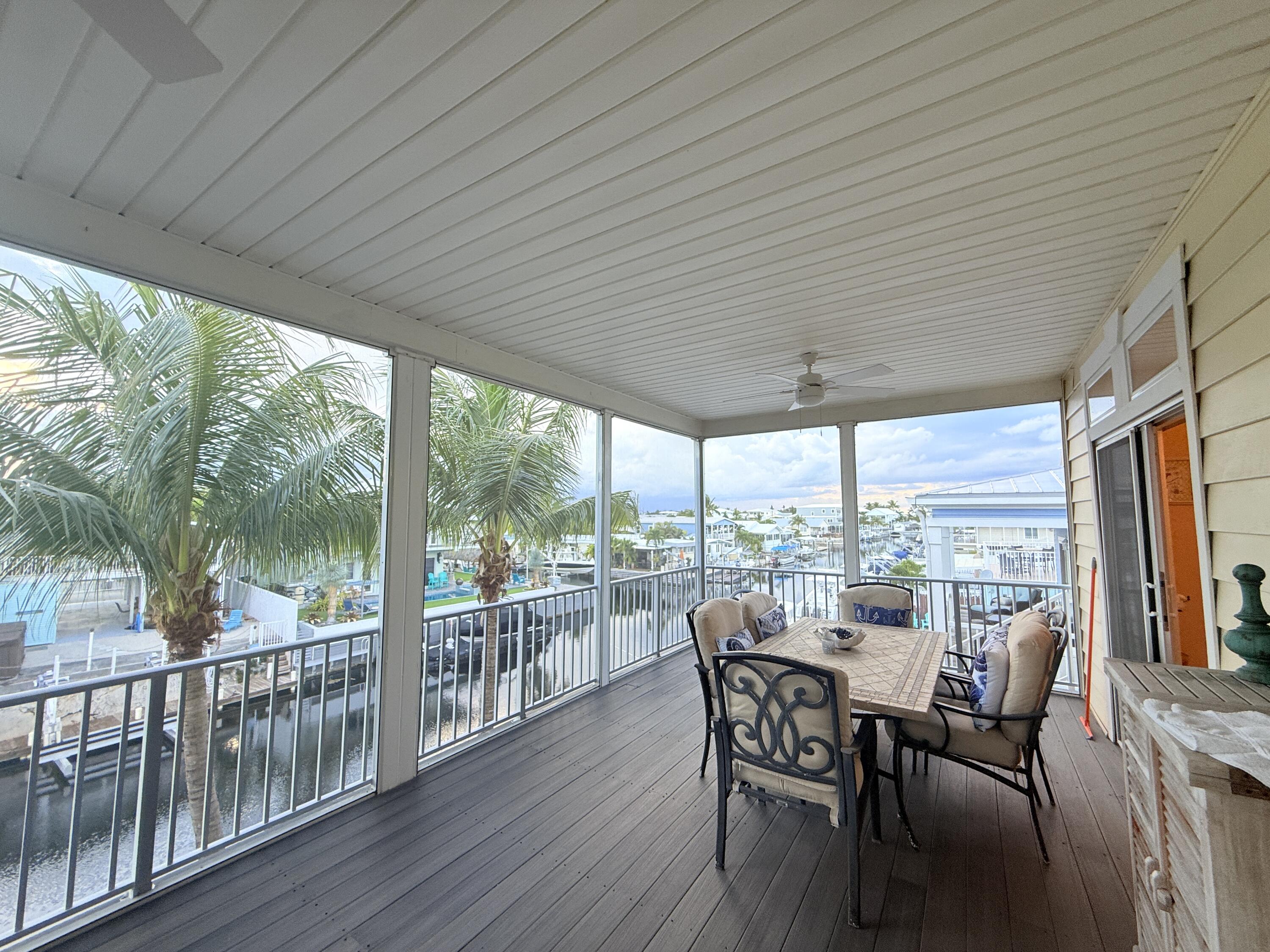 903 Tropical Lane Key Largo, FL 33037 - Photo 30 of 46 a view of a dining room with furniture window and outside view