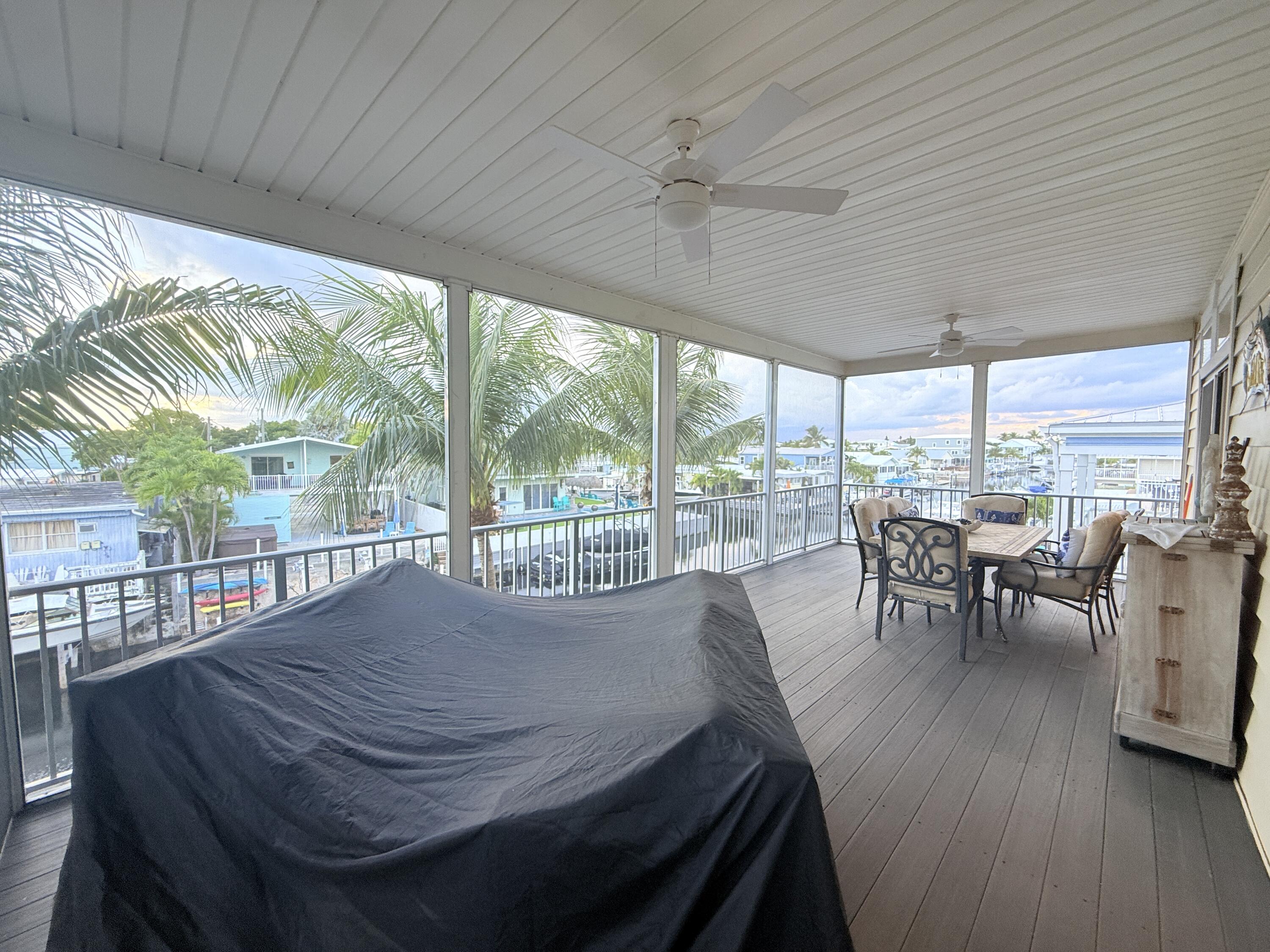 903 Tropical Lane Key Largo, FL 33037 - Photo 31 of 46 a view of a dining room with furniture window and outside view