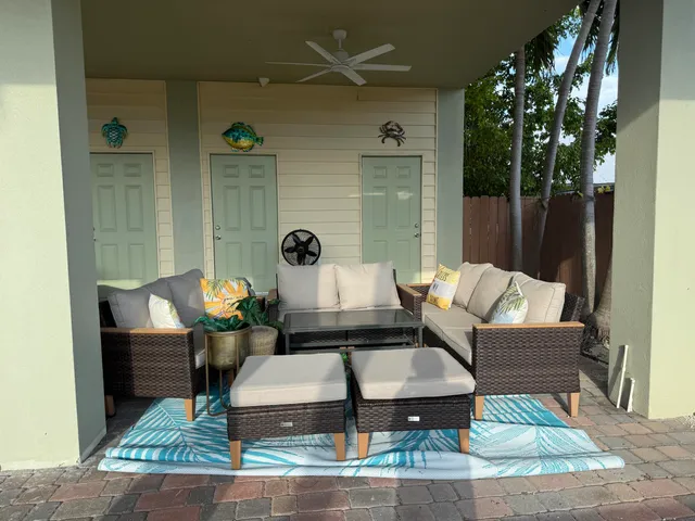 a large bed sitting in a kitchen next to a living room