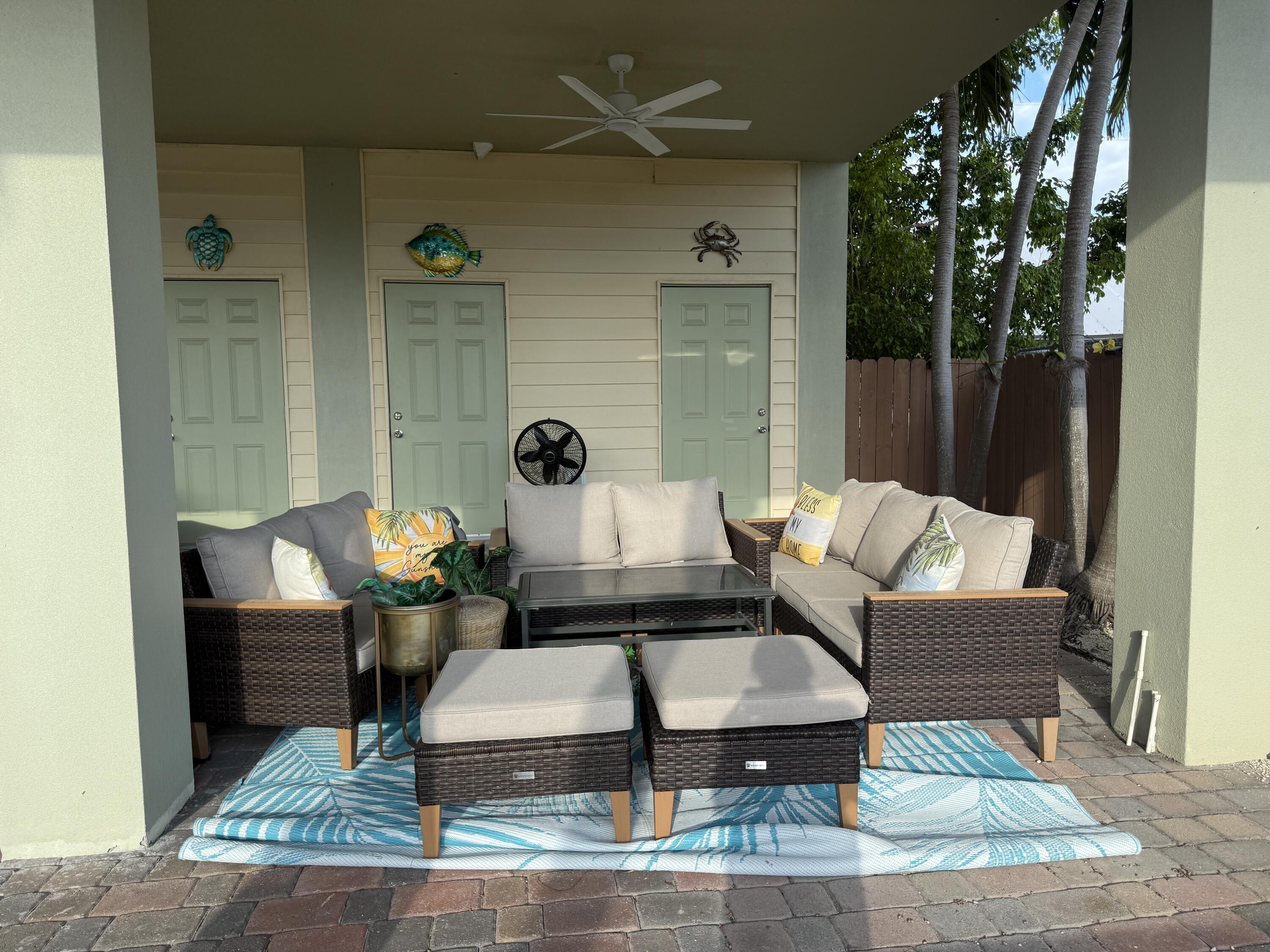 903 Tropical Lane Key Largo, FL 33037 - Photo 35 of 46 a living room with furniture and a potted plant