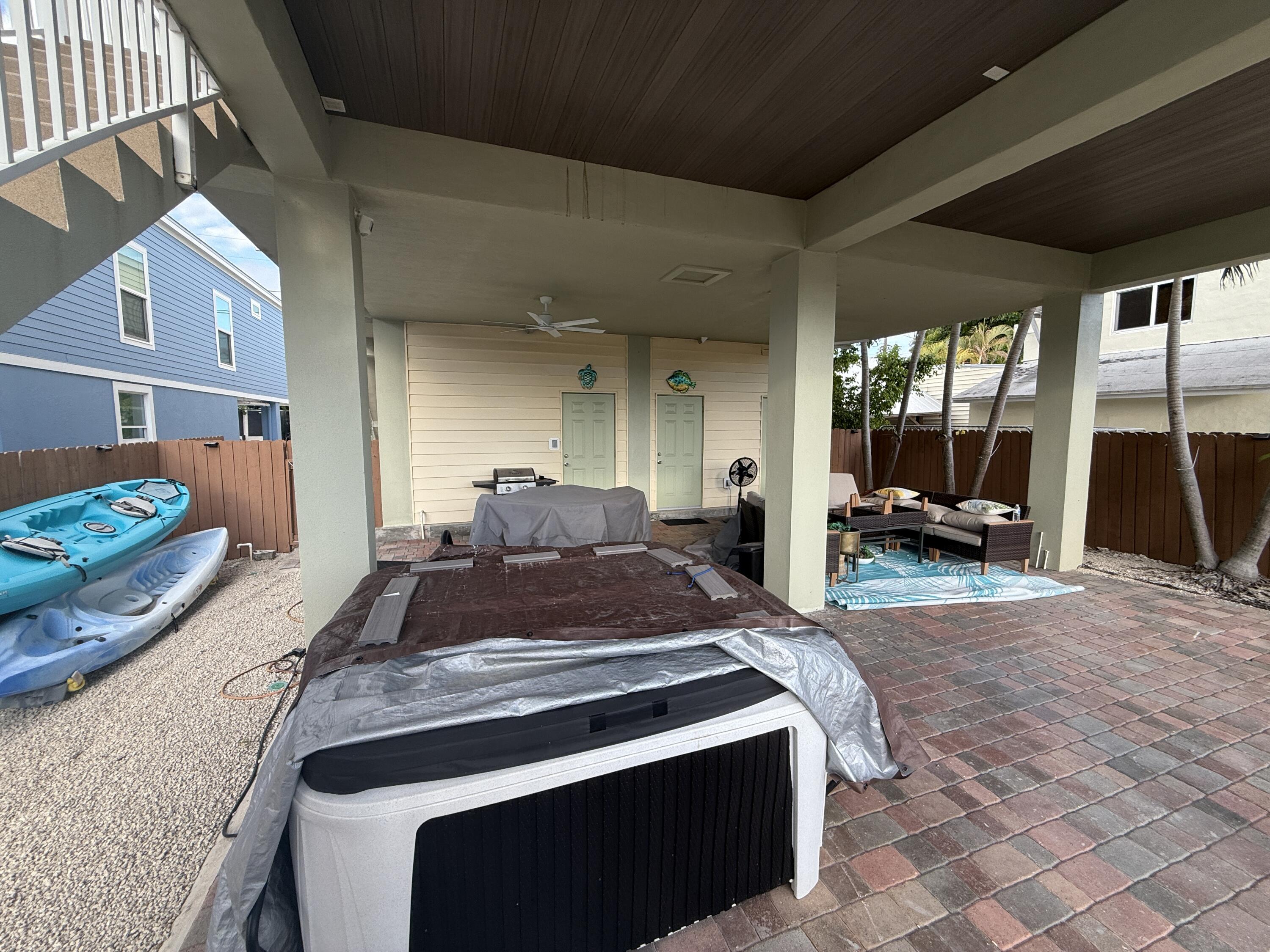 903 Tropical Lane Key Largo, FL 33037 - Photo 37 of 46 a large bed sitting in a kitchen next to a living room