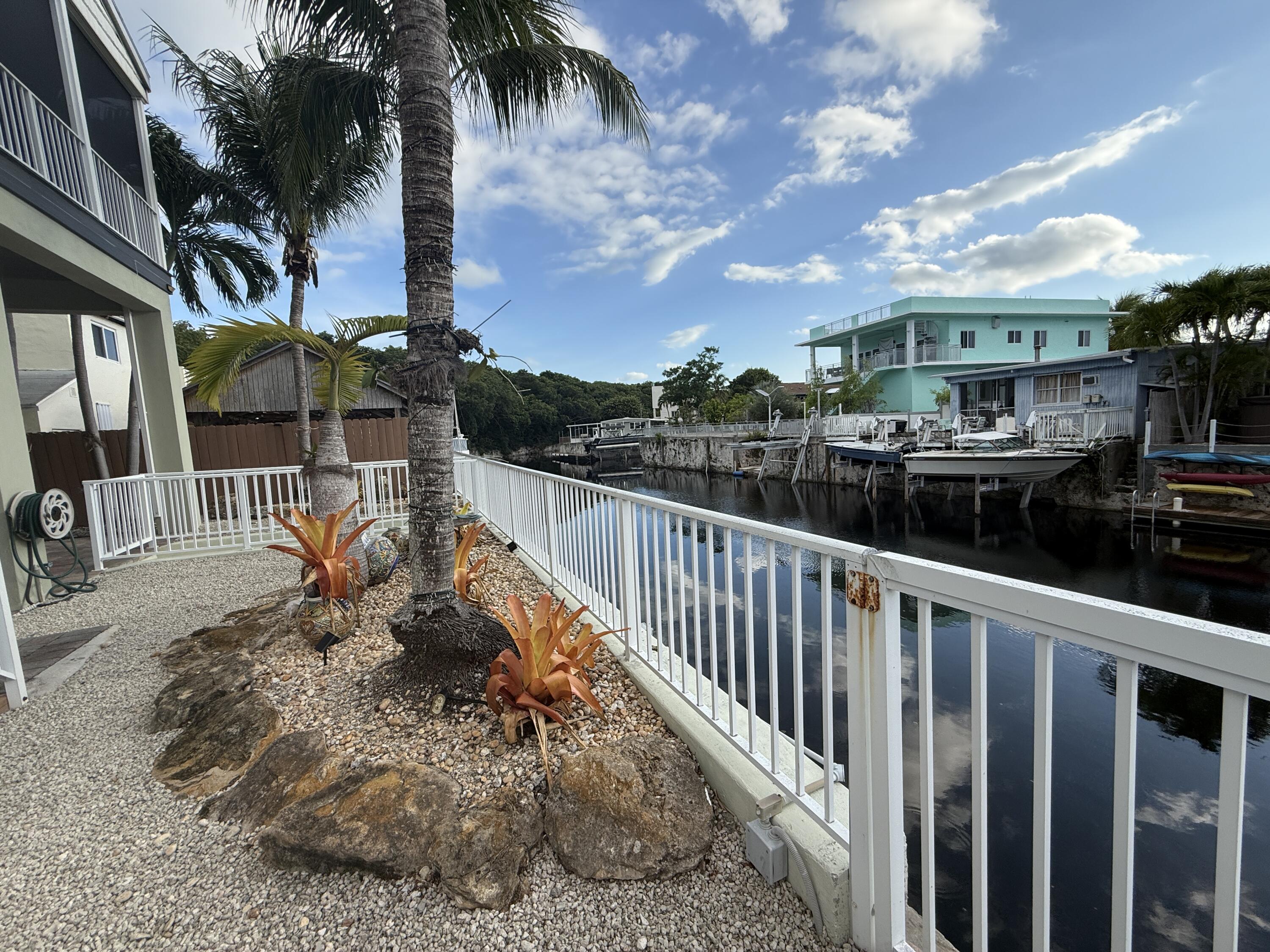 903 Tropical Lane Key Largo, FL 33037 - Photo 38 of 46 a view of a houses with a patio