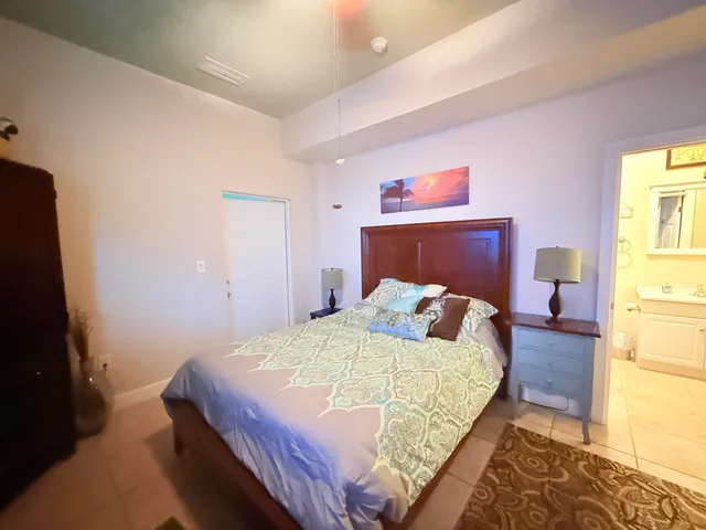 a bathroom with a toilet a sink and a mirror