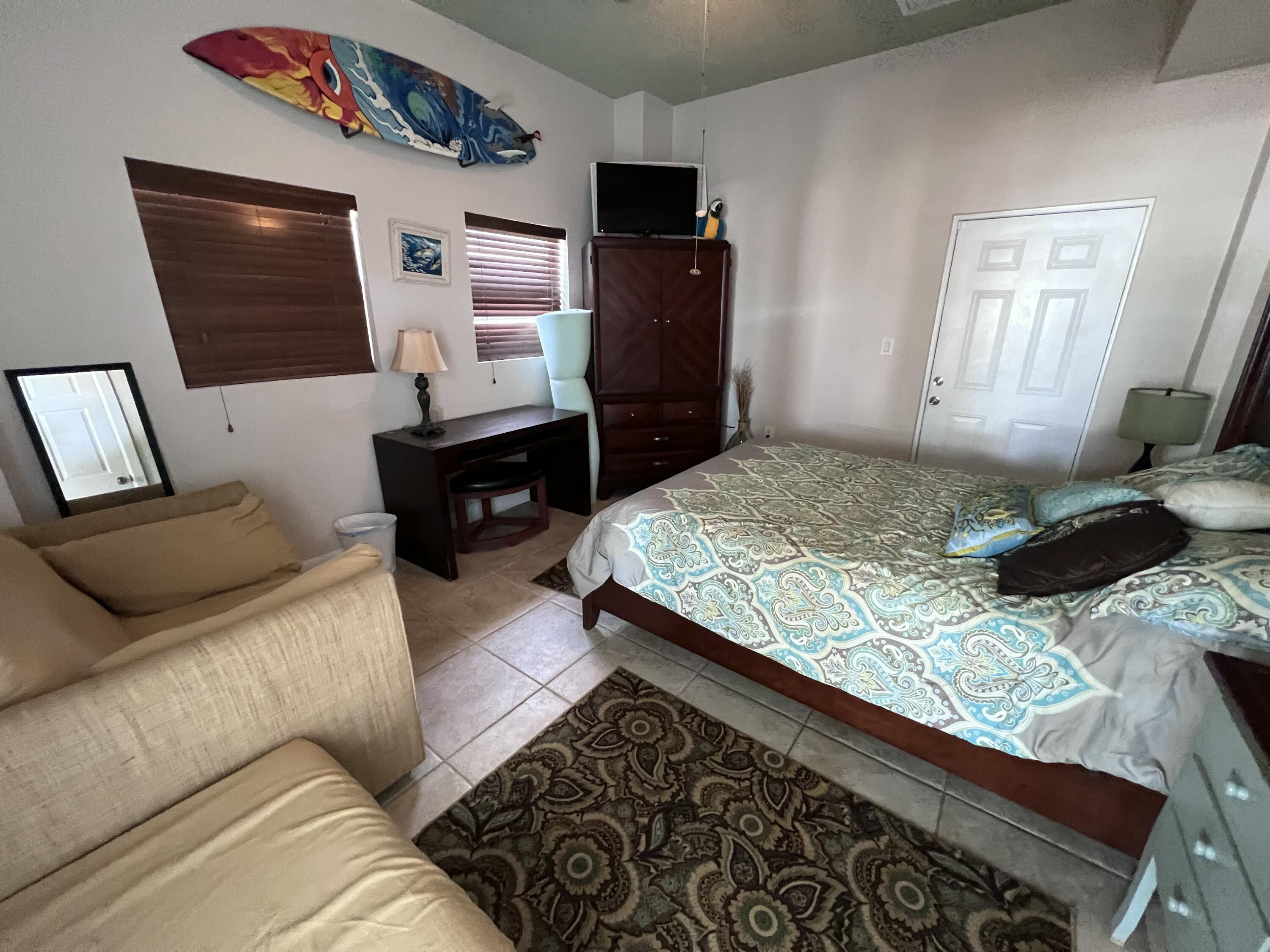 903 Tropical Lane Key Largo, FL 33037 - Photo 42 of 46 a living room with furniture and a flat screen tv