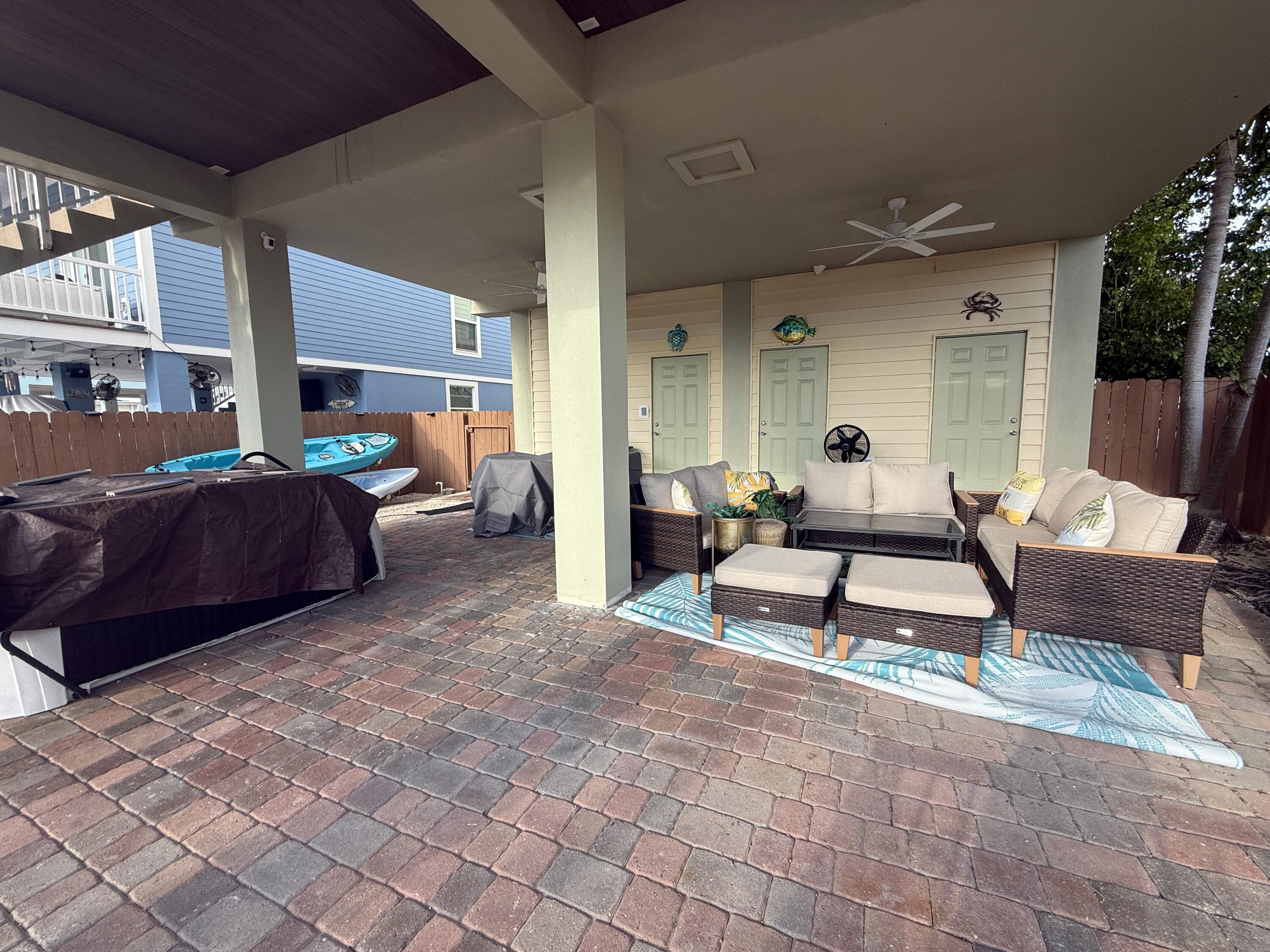 903 Tropical Lane Key Largo, FL 33037 - Photo 8 of 46 a living room with furniture and a potted plant