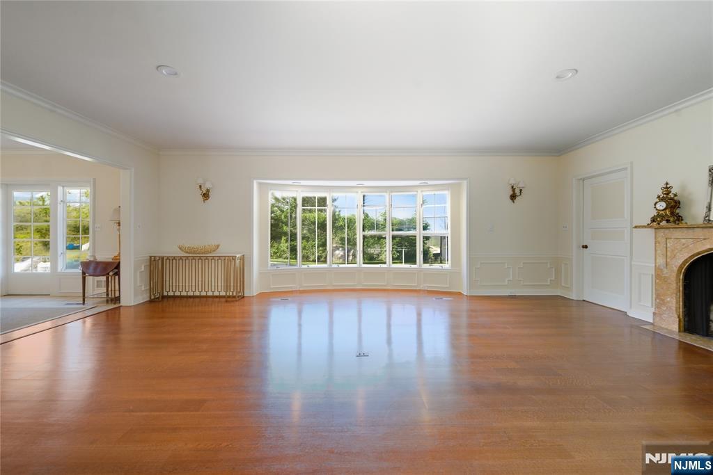 18 Pepperidge Tree Terrace Butler, NJ 07405 - Photo 14 of 35 a view of empty room with wooden floor and fireplace