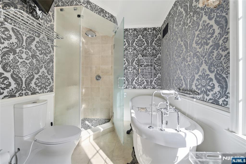 18 Pepperidge Tree Terrace Butler, NJ 07405 - Photo 16 of 35 a bathroom with a sink toilet and shower