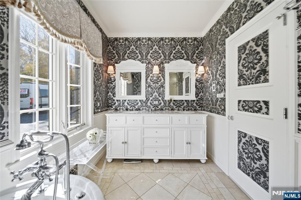 18 Pepperidge Tree Terrace Butler, NJ 07405 - Photo 17 of 35 a bathroom with a sink mirror and a bathtub