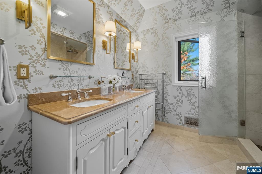 18 Pepperidge Tree Terrace Butler, NJ 07405 - Photo 23 of 35 a bathroom with a sink and a mirror