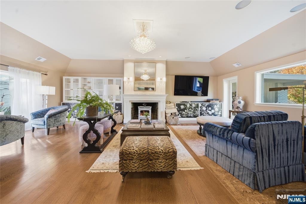 18 Pepperidge Tree Terrace Butler, NJ 07405 - Photo 3 of 35 a living room with furniture fireplace and a flat screen tv