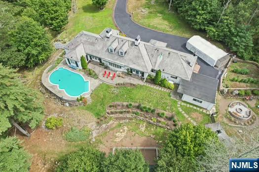 18 Pepperidge Tree Terrace Butler, NJ 07405 - Photo 33 of 35 an aerial view of a house with garden space and street view