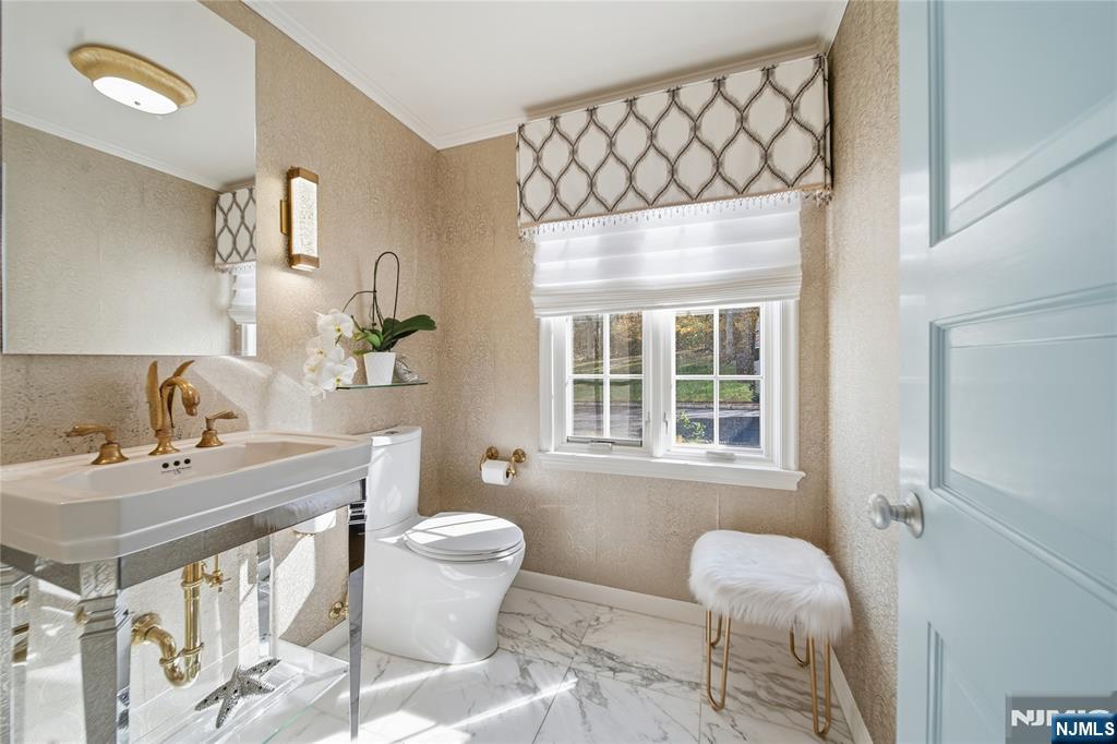 18 Pepperidge Tree Terrace Butler, NJ 07405 - Photo 9 of 35 a bathroom with a sink toilet and a mirror