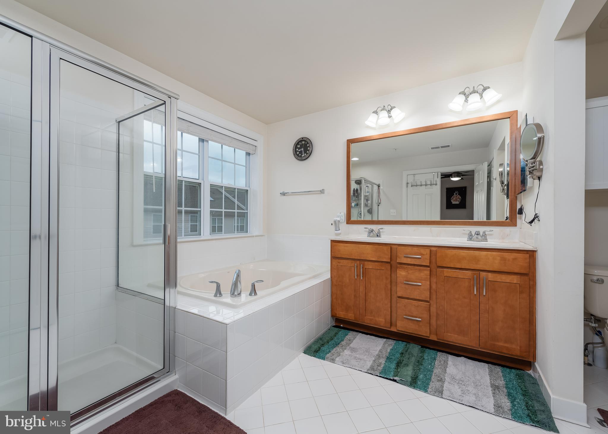 7665 Elmcrest Road Hanover, MD 21076 - Photo 17 of 37 Primary bathroom suite with sep tub and shower