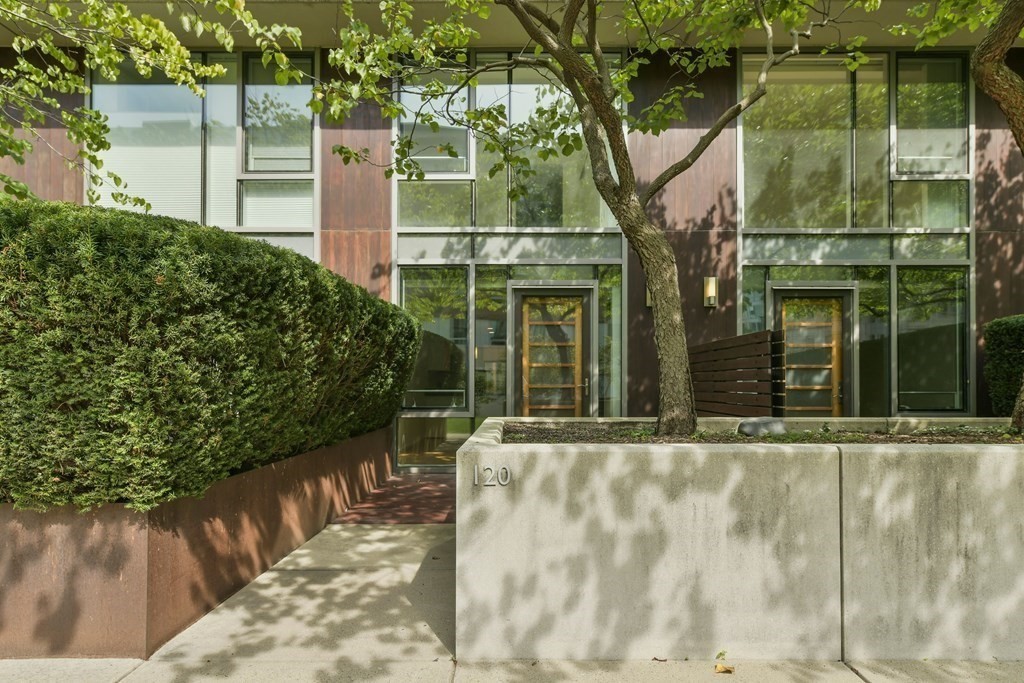 2 Earhart Street, Unit 120 Cambridge, MA 02141 - Photo 23 of 42 a view of a brick house with a large windows