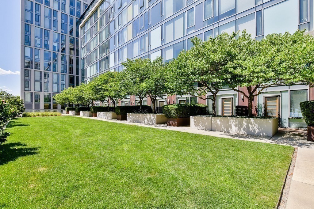 2 Earhart Street, Unit 120 Cambridge, MA 02141 - Photo 26 of 42 a front view of a building with a garden