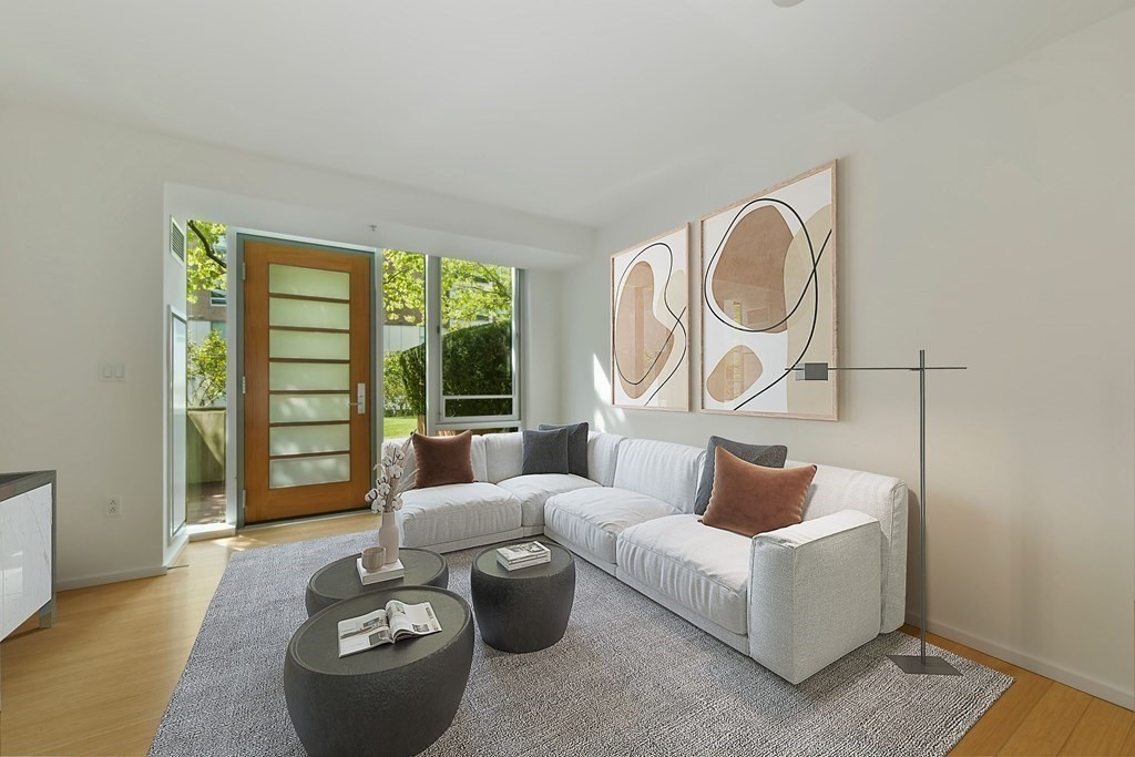2 Earhart Street, Unit 120 Cambridge, MA 02141 - Photo 6 of 42 a living room with furniture and a large window