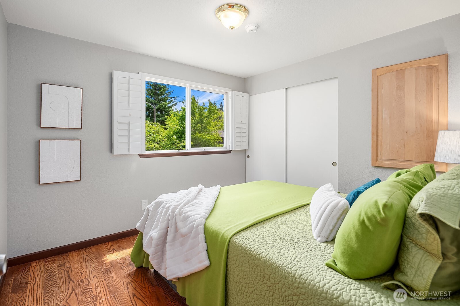 409 169th Street Southeast Bothell, WA 98012 - Photo 16 of 31 a bed sitting in a bedroom next to a window