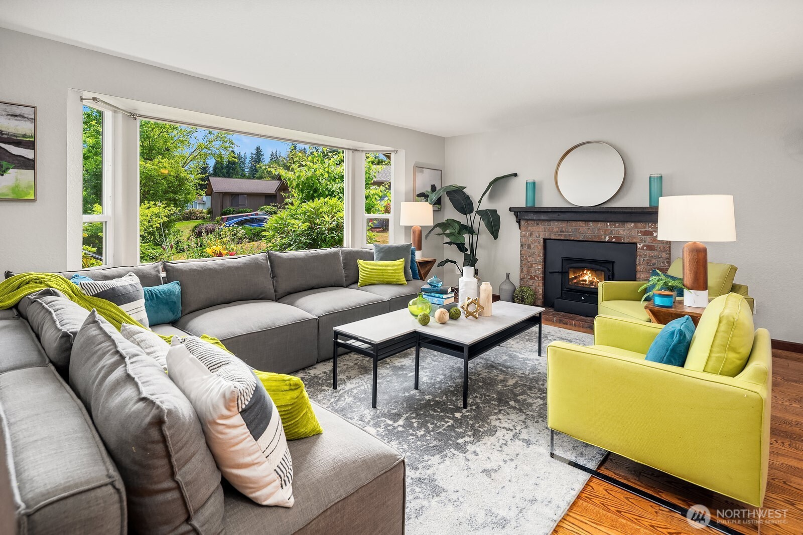 409 169th Street Southeast Bothell, WA 98012 - Photo 2 of 31 a living room with furniture fireplace and a large window