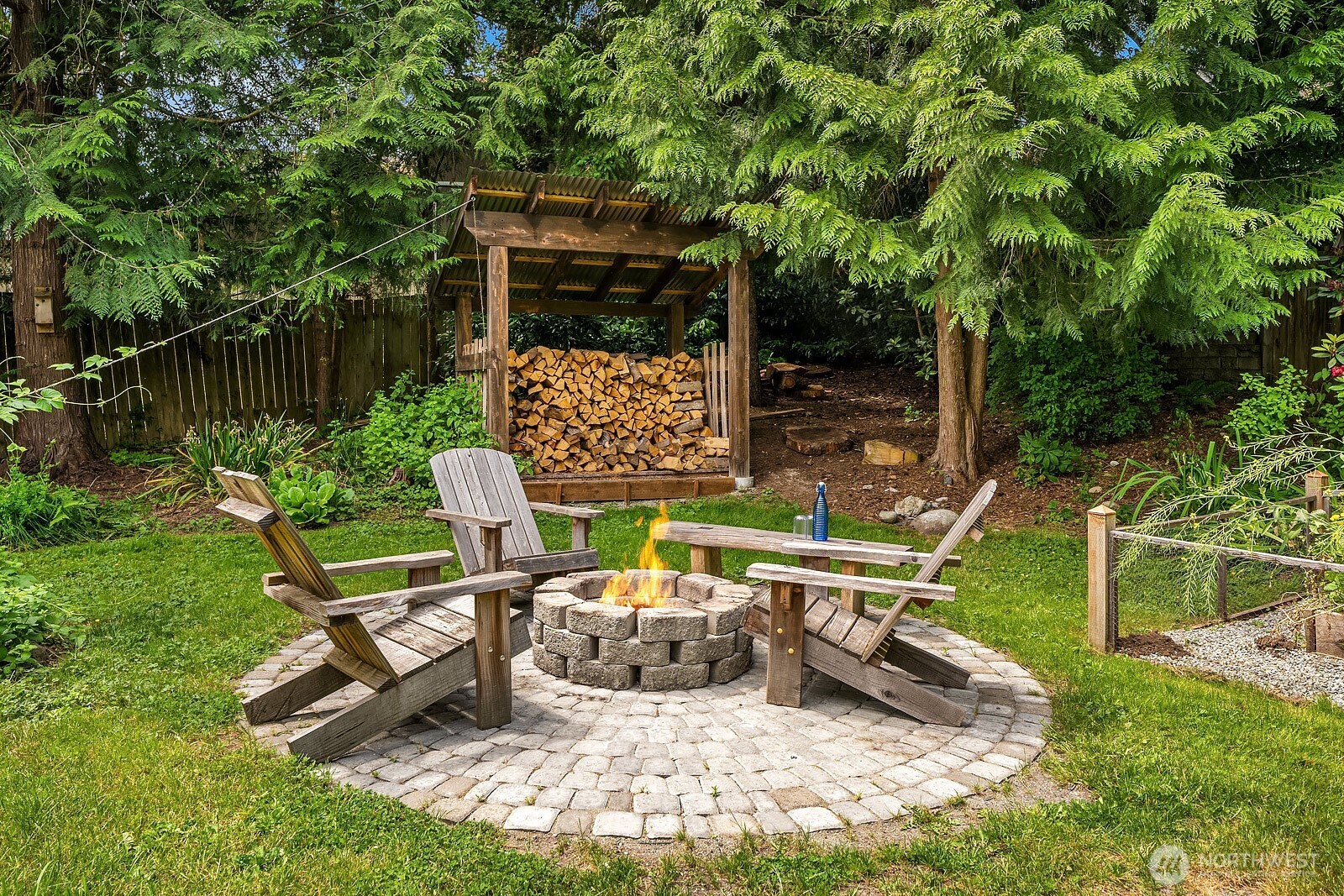 409 169th Street Southeast Bothell, WA 98012 - Photo 26 of 31 a view of a chair and tables in the backyard