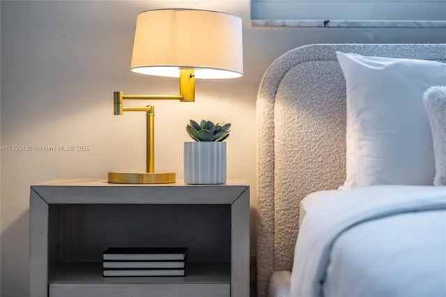 a bedroom with a bed and a mirror