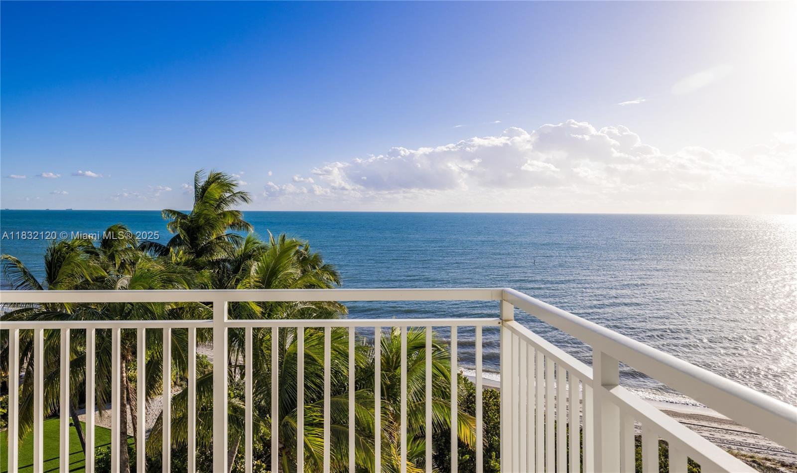 615 Ocean Drive, Unit 6A Key Biscayne, FL 33149 - Photo 27 of 40 a view of a balcony with wooden fence and floor