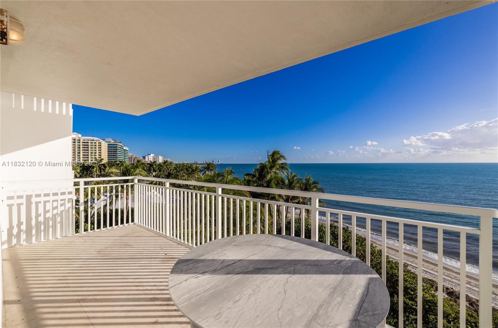 615 Ocean Drive, Unit 6A Key Biscayne, FL 33149 - Photo 32 of 40 a view of a balcony with wooden floor