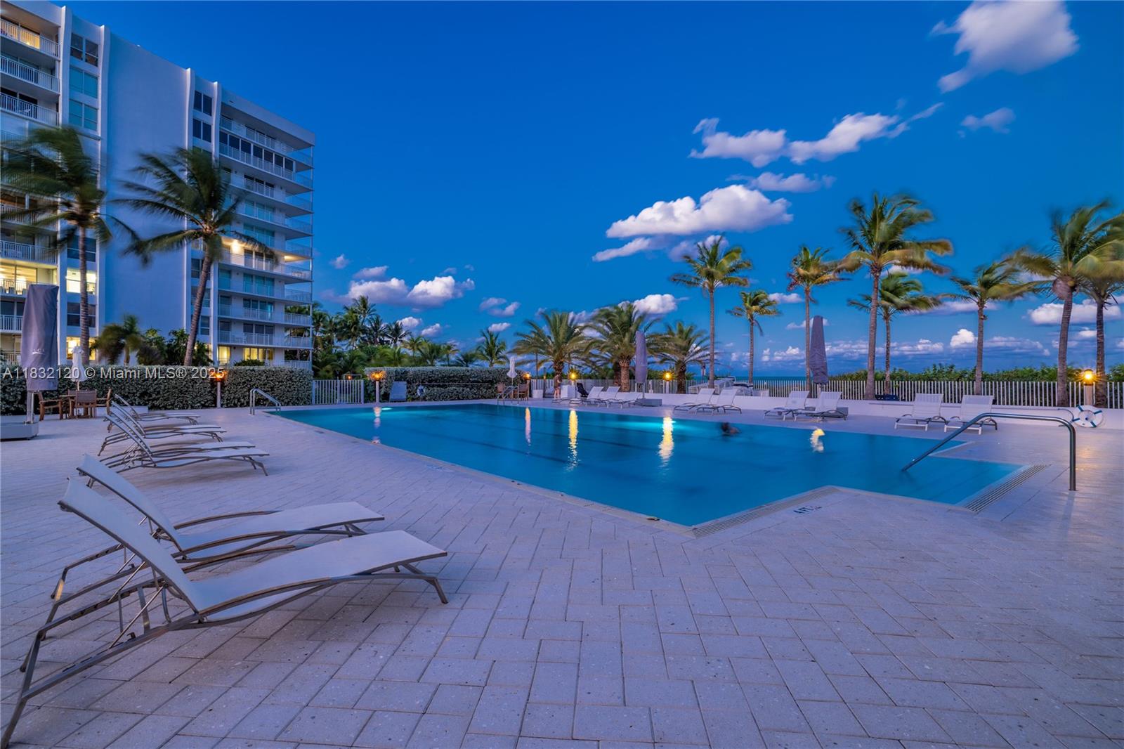 615 Ocean Drive, Unit 6A Key Biscayne, FL 33149 - Photo 37 of 40 a view of a patio with swimming pool