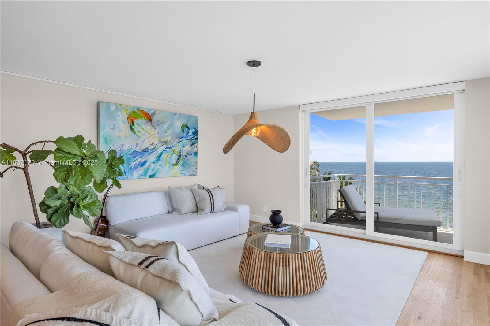 615 Ocean Drive, Unit 6A Key Biscayne, FL 33149 - Photo 4 of 40 a living room with furniture and a large window