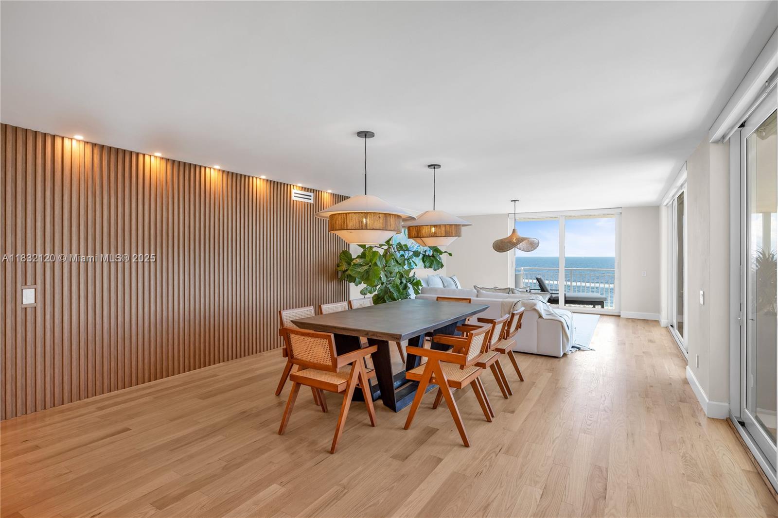 615 Ocean Drive, Unit 6A Key Biscayne, FL 33149 - Photo 5 of 40 a view of a dining room with furniture and wooden floor