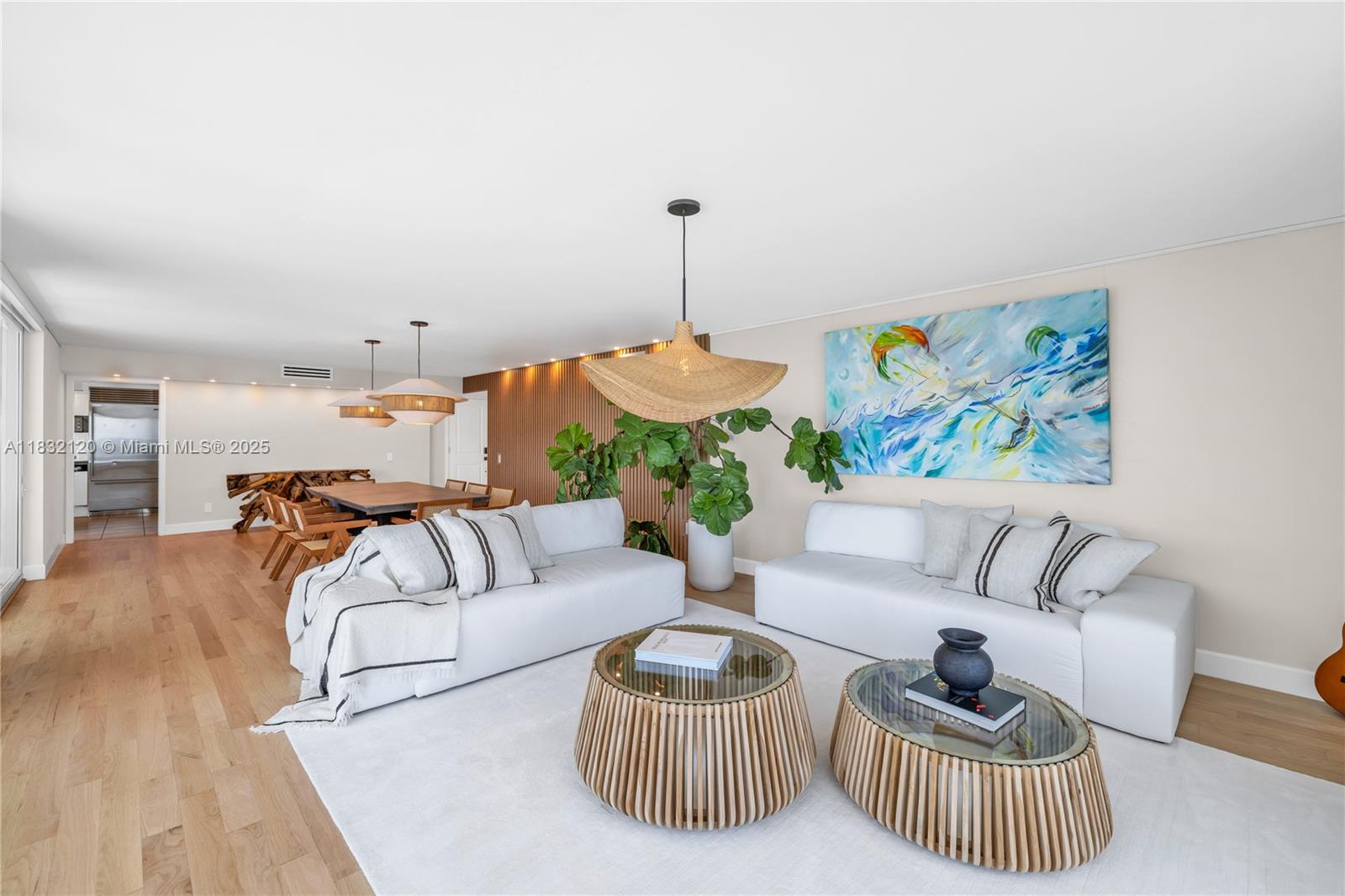 615 Ocean Drive, Unit 6A Key Biscayne, FL 33149 - Photo 7 of 40 a living room with furniture and a wooden floor