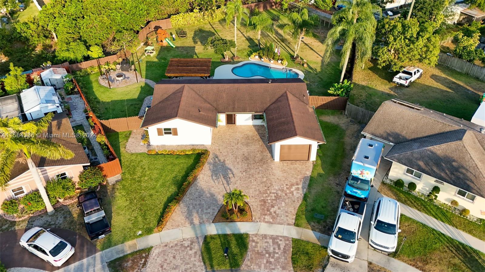 10300 Sleepy Brook Way Boca Raton, FL 33428 - Photo 36 of 41 an aerial view of a house with a yard and a large tree