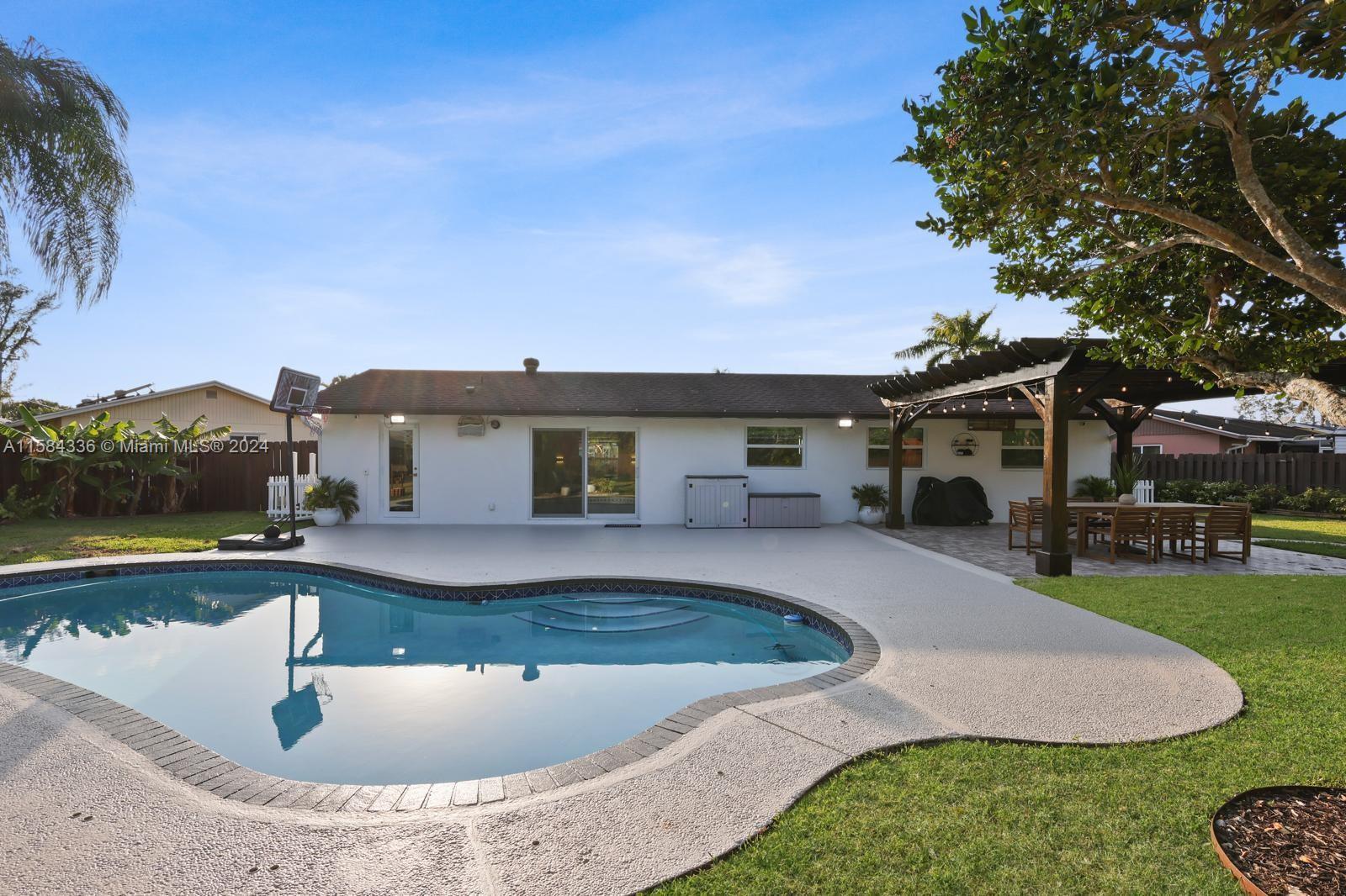 10300 Sleepy Brook Way Boca Raton, FL 33428 - Photo 4 of 41 a swimming pool view with a outdoor seating