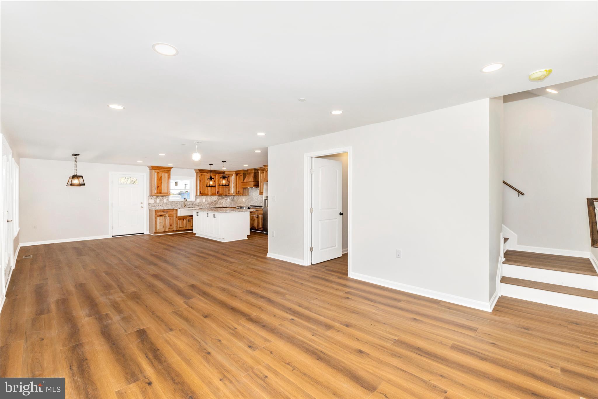 10910 Liberty Road Frederick, MD 21701 - Photo 16 of 51 a big room with wooden floor and a large window