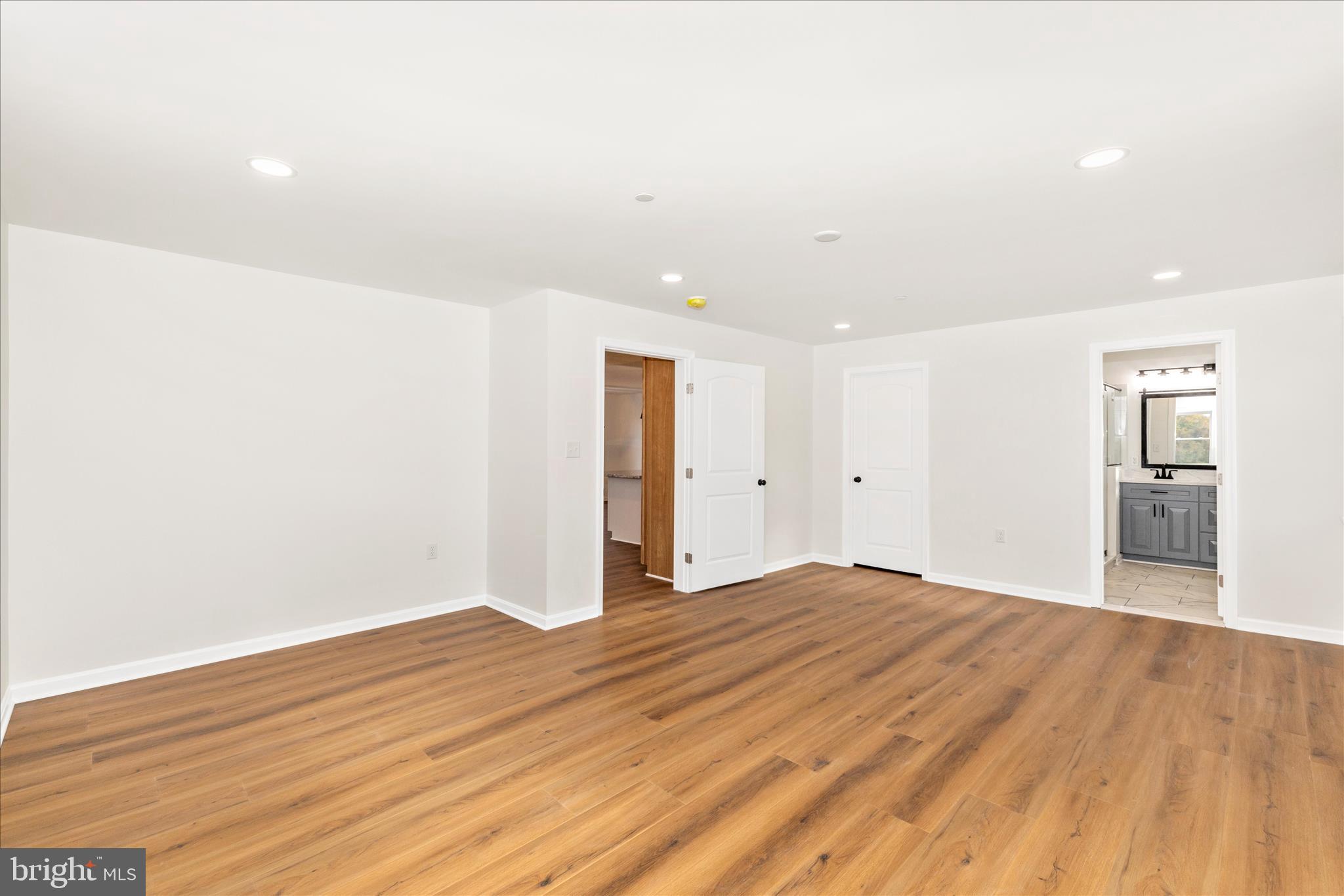 10910 Liberty Road Frederick, MD 21701 - Photo 22 of 51 a view of an empty room with wooden floor