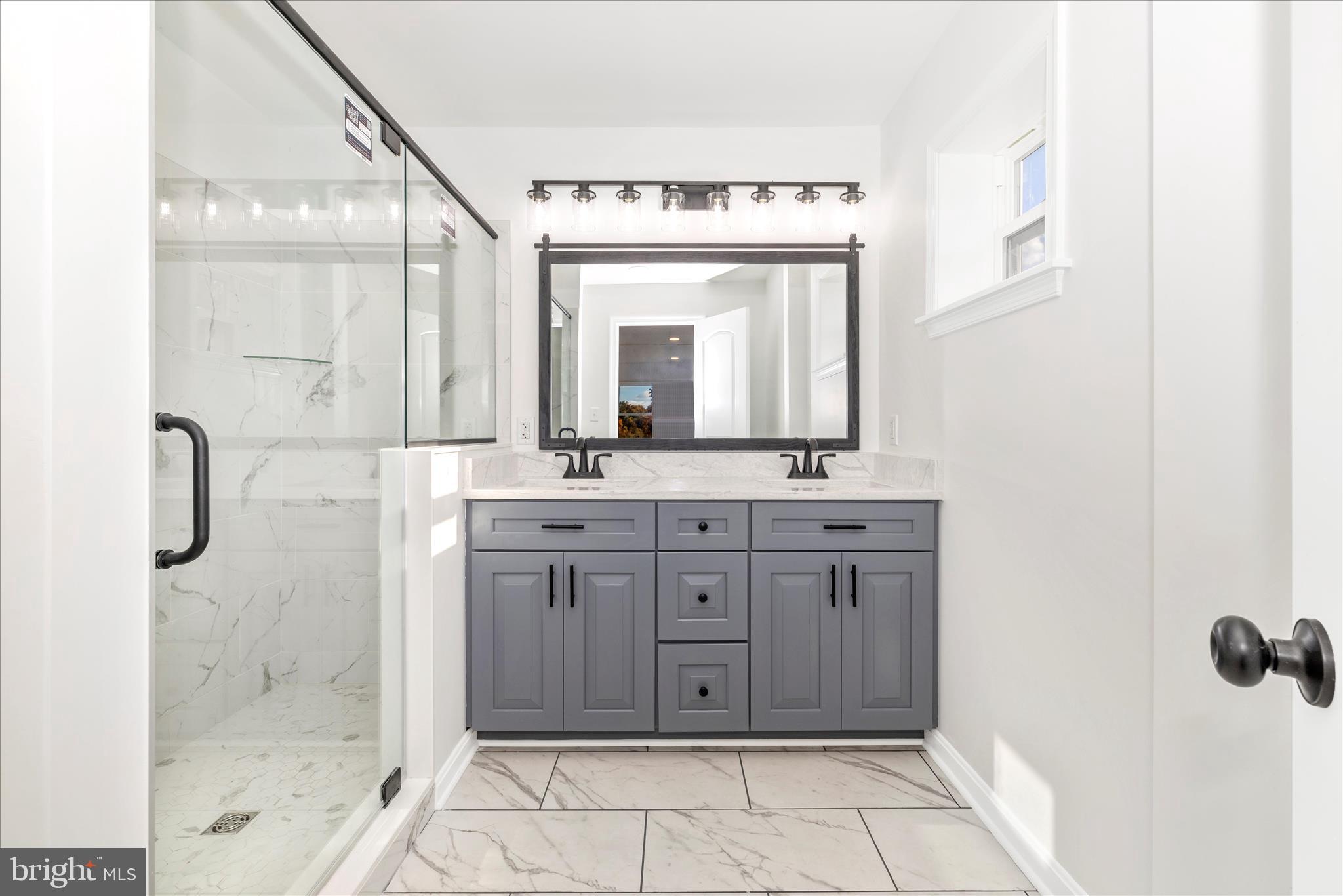 10910 Liberty Road Frederick, MD 21701 - Photo 24 of 51 a bathroom with a granite countertop sink mirror and a