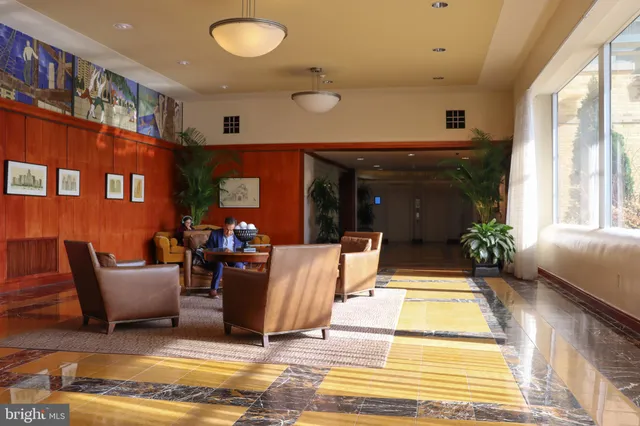 a living room with furniture and a rug
