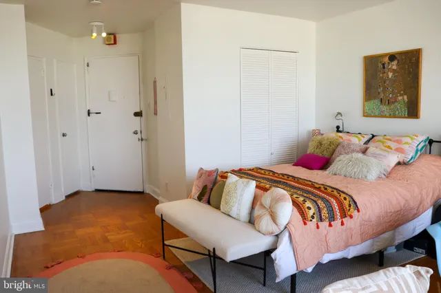 a bedroom with a bed and couch