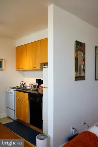 a kitchen with a stove and a refrigerator
