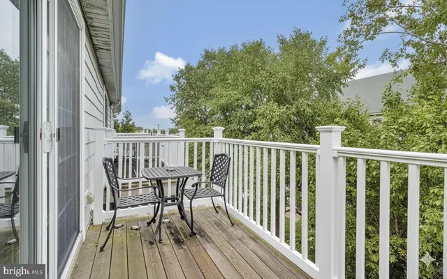 a view of a wooden chairs on deck